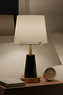 Modern metal table lamp with elegant finish designed for bedside tables and contemporary home decor.