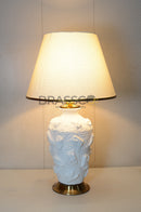 Ceramic White Designer GB table lamp featuring a textured ceramic base, elegant white fabric shade, and modern decorative design for bedrooms and living rooms.