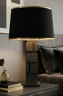 Natural wood table lamp with geometric box design and soft ambient lighting.