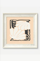 Contemporary wall artwork arranged above a low sideboard in a stylish living room.