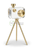 Crystal camera table decor displayed on a modern office desk beside books and accessories.