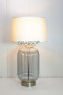 Smoky LininDiscover the Brassco Smoky Lining Glass Table Lamp featuring a premium smoky glass base, elegant lining design, fabric lampshade, E27 compatibility, and warm ambient lighting for luxury interiors.

🌐 SEO URL Handleg Glass Table Lamp 23.5" | Luxury Designer Lamp | Brassco Pakistan