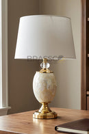 FG finish oval table lamp with Mother of Pearl accents for stylish décor