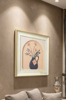 Flower pot wall painting frame displayed above a wooden console in a bright entryway.