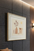 Food-themed decorative painting displayed in a home kitchen beside a wooden breakfast table.
