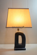 Modern grey D-shape fiber table lamp with beige fabric shade, providing warm ambient lighting for bedrooms, living rooms, and contemporary home interiors.