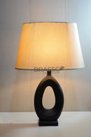 Modern grey Oval-shape fiber table lamp with beige fabric shade, providing warm ambient lighting for bedrooms, living rooms, and contemporary home interiors.