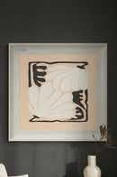 Modern framed wall painting displayed above a minimalist console in a contemporary entryway.