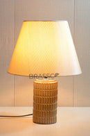 Elegant brown ceramic table lamp with fabric shade, providing warm ambient lighting for bedrooms, living rooms, and modern home interiors.