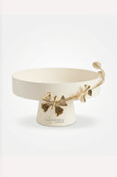 Off-white metal serving tray arranged on a dining room sideboard for a stylish dessert display.