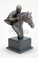 Resin jockey ornament showcased inside a glass display cabinet in a sophisticated interior.
