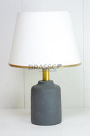 Small black resin lamp displayed as an accent for bedroom furniture
