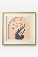 Square flower pot artwork decorating a kitchen wall near an indoor herb plant.