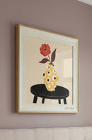Square vase wall artwork arranged on a neutral dining room wall to complement the interior decor.