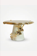 White and gold serving tray arranged on a dining room console for a sophisticated interior look.