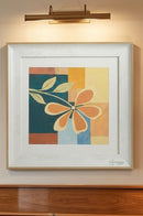 Yellow flower wall painting frame displayed above an entryway console in a modern home.