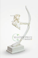 Brown and off-white bow sculptures arranged on separate display shelves in a modern home interior.
